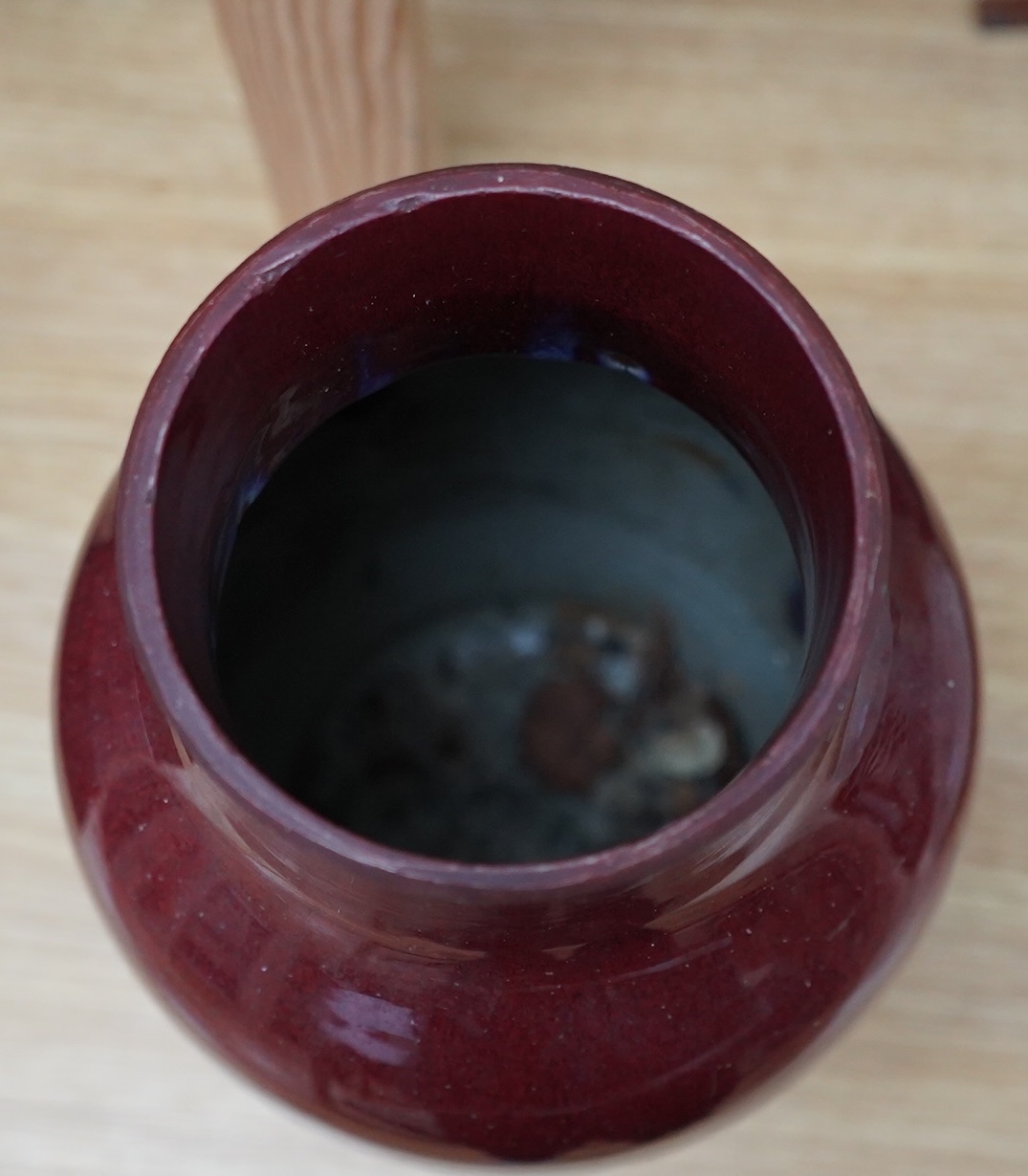 An 18th century Chinese sang de boeuf glazed vase, 34cm. Condition - ground down